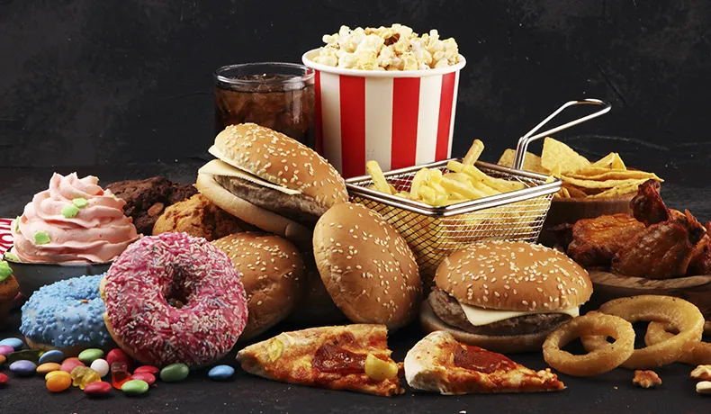 https://www.precisionorthomd.com/wp-content/uploads/2023/10/percision-blog-header-junk-food-102323.jpg
